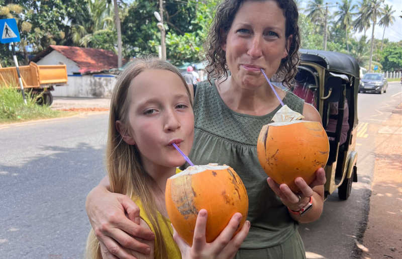 Mother and daughter drinking coconut milk on Sri Lanka holiday - Feb half term, Easter, Summer, October and Christmas are all options