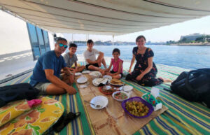 Family dinner aboard a felucca on the River Nile