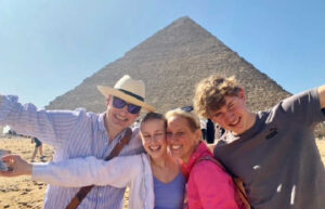 Family taking a selfie portrait at the pyramids in Egypt