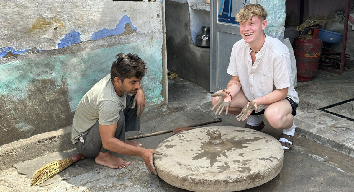 Photo of teenager making his own pot on a family trip to India