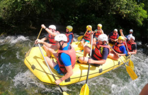 Teenagers rafting in Croatia