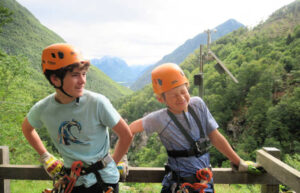 Two oys preparing to zip line in Bovec, Slovenia