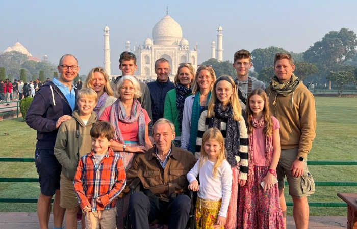 Extended multigenerational family in front of the Taj Mahal, India