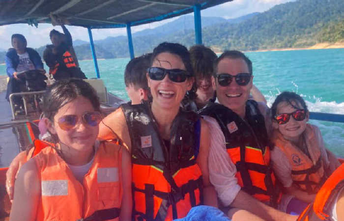 Family enjoying a boat trip in Thailand