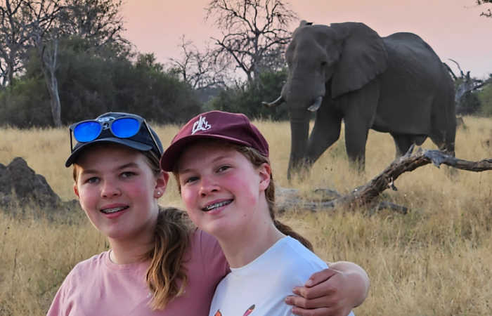 Botswana and Zimbabwe itinerary, teenagers with elephant in Botswana