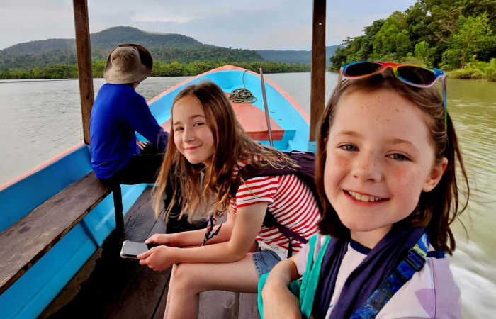 Family on river boat trip in Cambodia