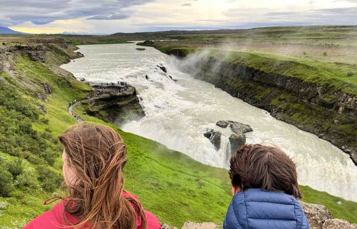 Hiking by rivers and waterfalls in Iceland on family holidays in Europe