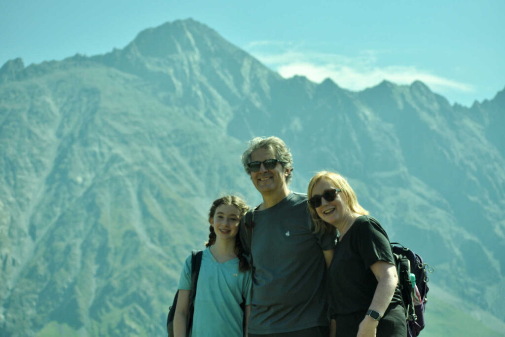 Family hiking in the Caucasus mountains