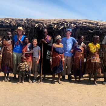 Photos of Tanzania - family posing with local Tanzanians