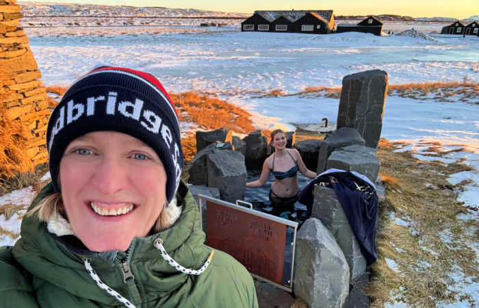 Iceland private thermal hot spring in winter, mother and daughter