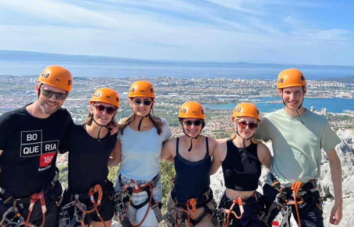 Family with teenagers climbing in Croatia