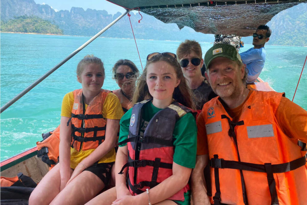 Thailand family easter holiday, parents and kids on boat, turquoise sea