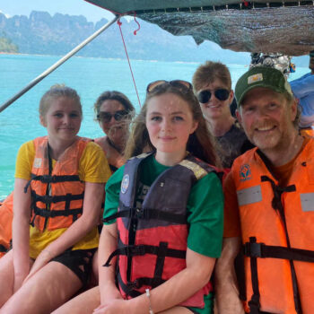 Thailand family easter holiday, parents and kids on boat, turquoise sea