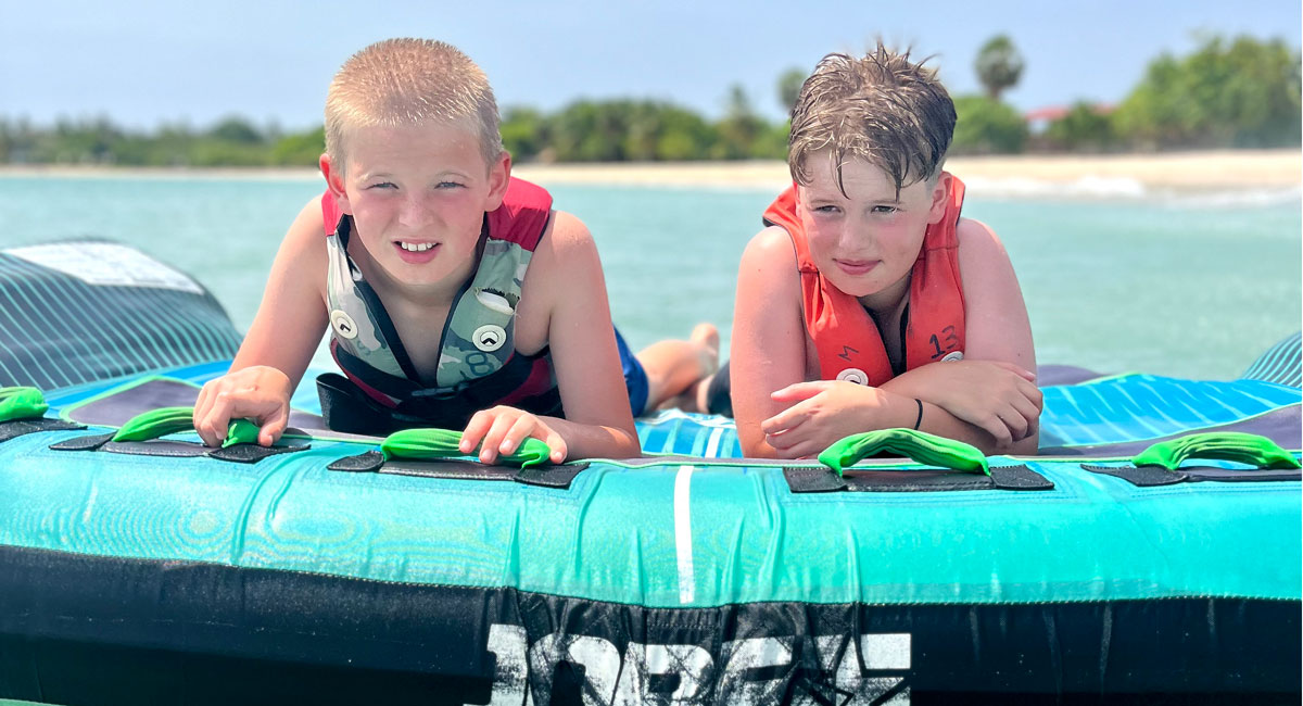 Boys enjoying fun ocean activities in Sri Lanka