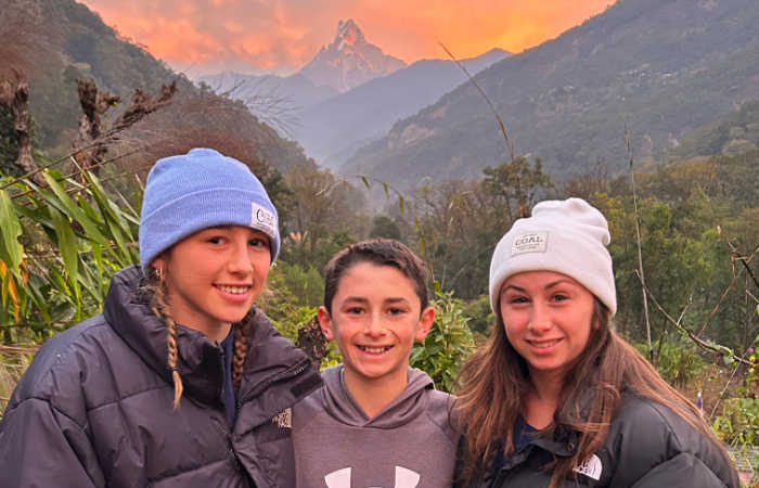 Hiking in Nepal, Himalaya backdrop at sunset, guide to family travel in Asia