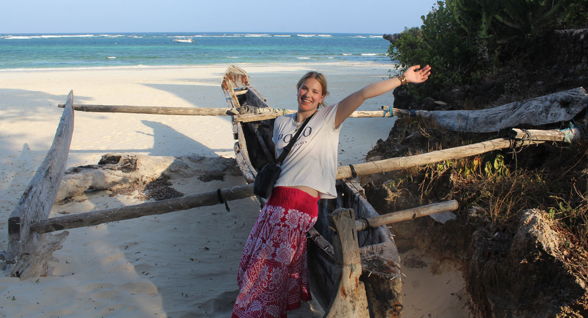 Family expressing pleasure at arriving at the Kenya beach - 50th birthday holiday ideas