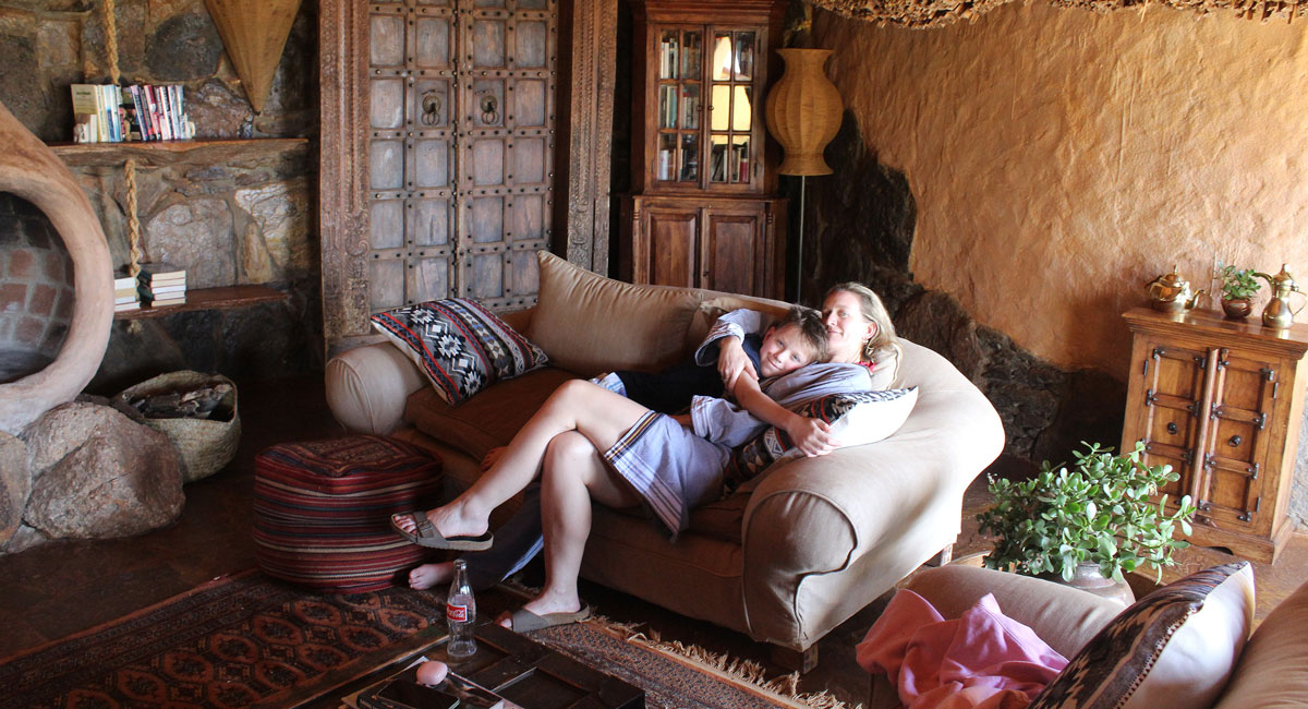M and son sharing a cuddle in Laikipia lodge