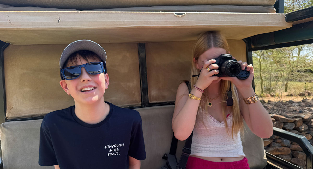 Kids in a safari jeep in Kenya celebrating their mum's 50th birthday