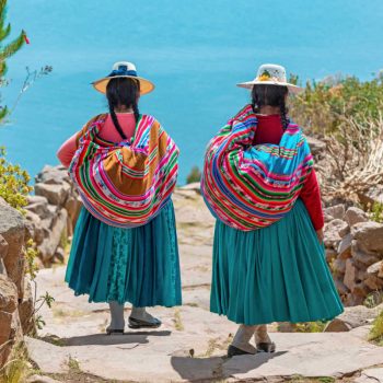 Women in traditional dress at Lake Titicaca, Peru, Latin America family travel guide