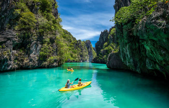 People kayaking at El Nido, Philippines family holiday activity
