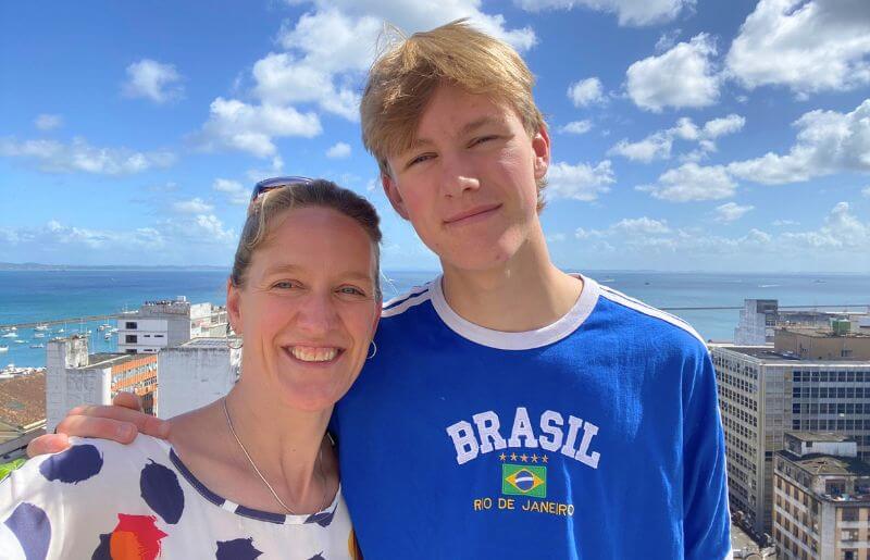 Mother and son in Brazil on Easter family holiday, with blue sky vista