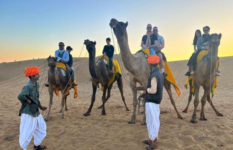 Family on a camel trek in Northern India