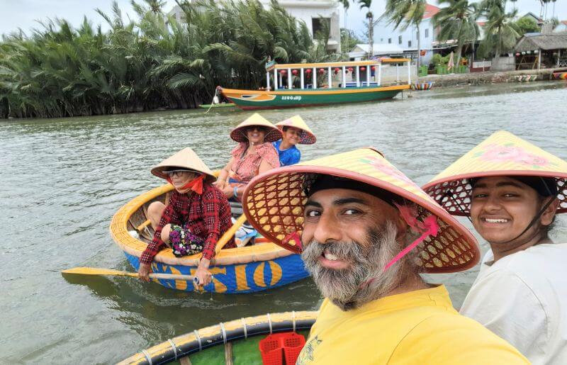 A family enjoying a ride in traditional round bamboo basket boats in Hoi An - ideal Easter holiday destinations