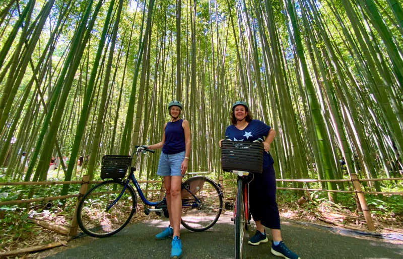 Emma and Lee cycling in bamboo forest, Japan, her choice for 2026