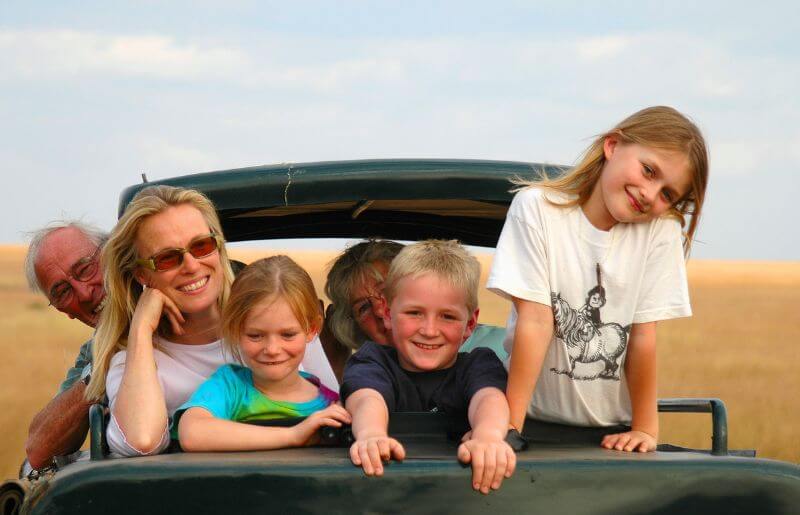 Family with grandparents on safari in Kenya