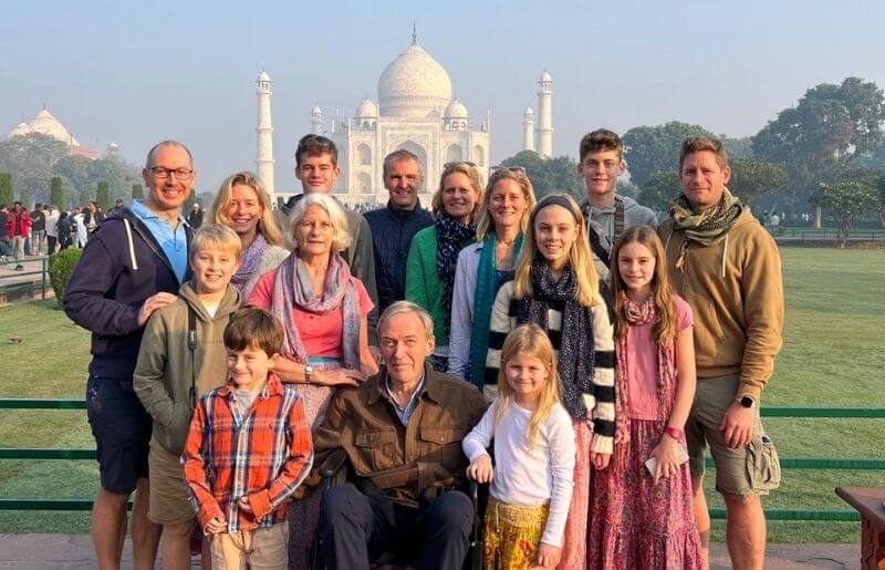 Extended multi-generational family in front of the Taj Mahal, India