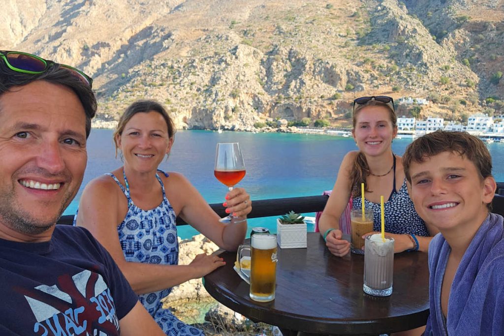 Family eating al fresco in Greece, Europe travel guide for families