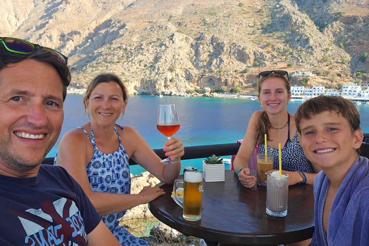 Family eating al fresco in Greece, Europe travel guide for families