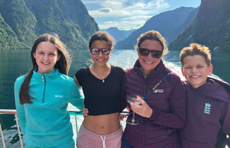 Family on Norway holiday, in the summer, on a fjord boat