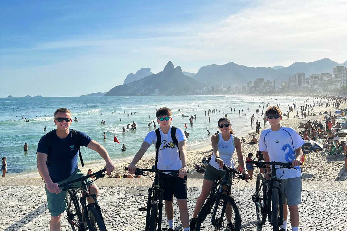 Rio de Janeiro, family cycling along the iconic beach on Brazil holiday with kids