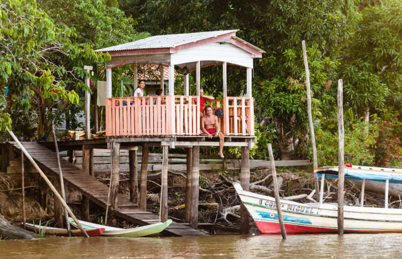 Amazon exploration with kids in Brazil, boats and local structure over river