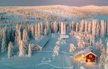 Cosy cabin amongst the wintry Swedish Lapland forest - family-friendly hotels in Sweden