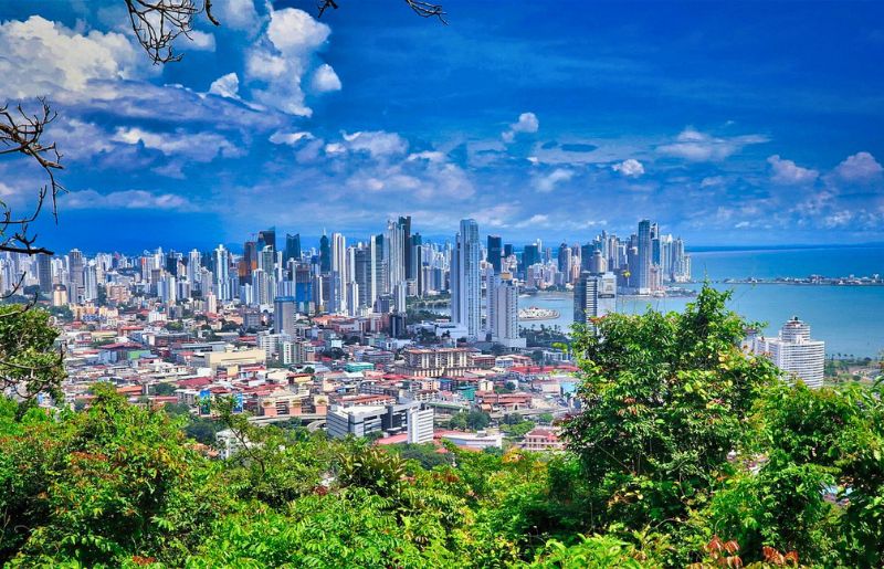 A view over the forest to the old town and skyscrapers of Panama City