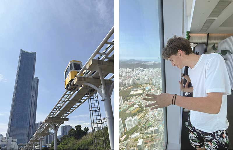 Teenager riding the Sky Capsule train in Busan, South Korea on family holiday