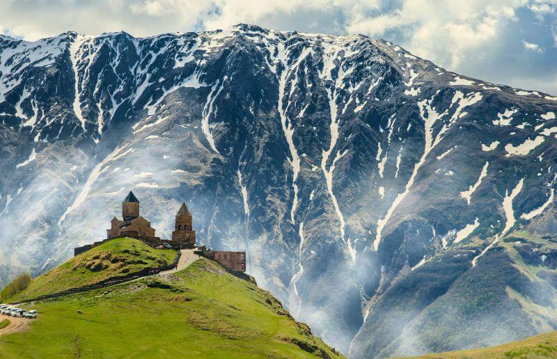 The Gergeti Church against a snowy mountain backdrop - family-friendly holidays to Georgia