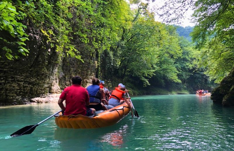 People rafting down the Martvili Canyon - places to visit in Georgia