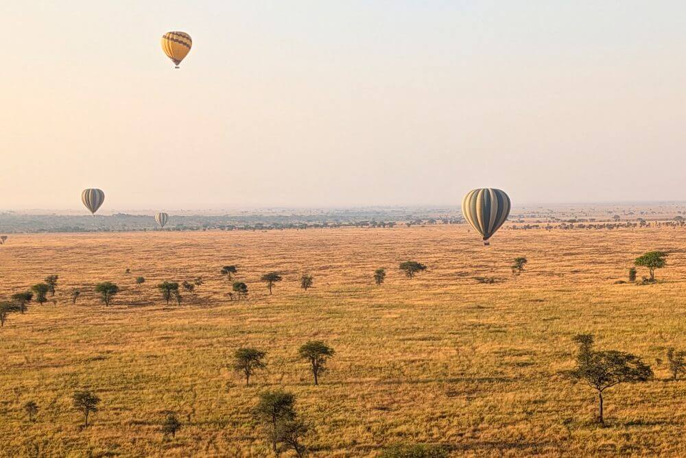 Hot air balloons over the Serengeti - places to visit in Tanzania